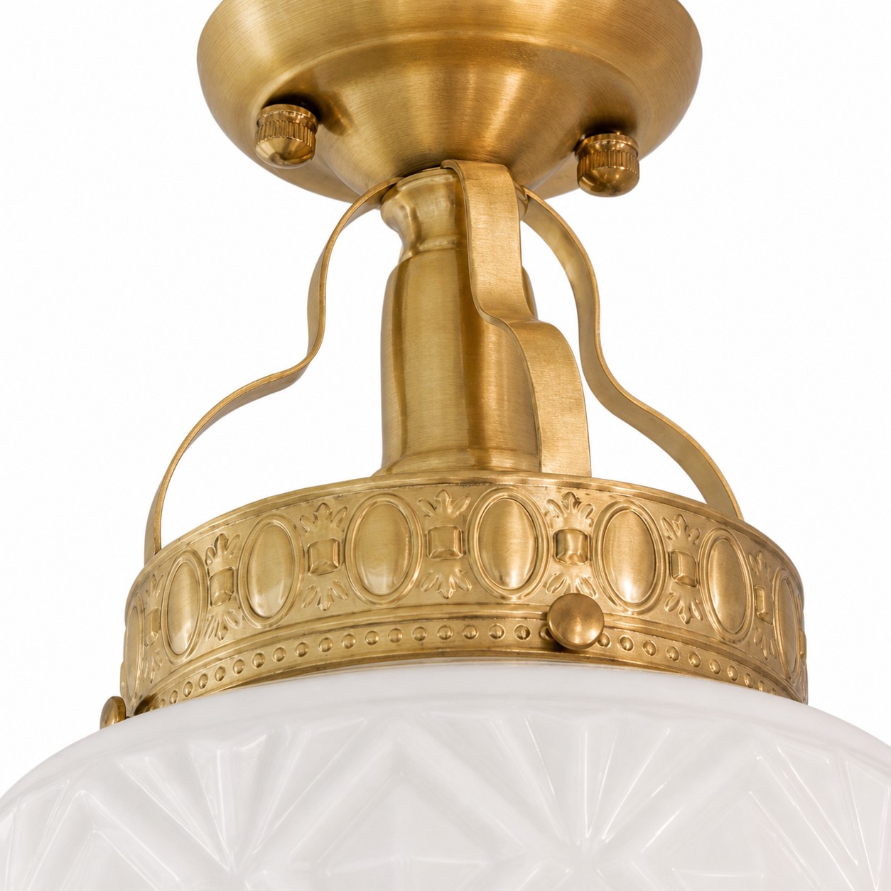 Brass-finish canopy and curved support detail